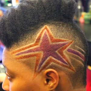 “Star hair design with clean fade haircut, featuring a bold star pattern shaved into the side, styled at Fwresh Barbershop.”